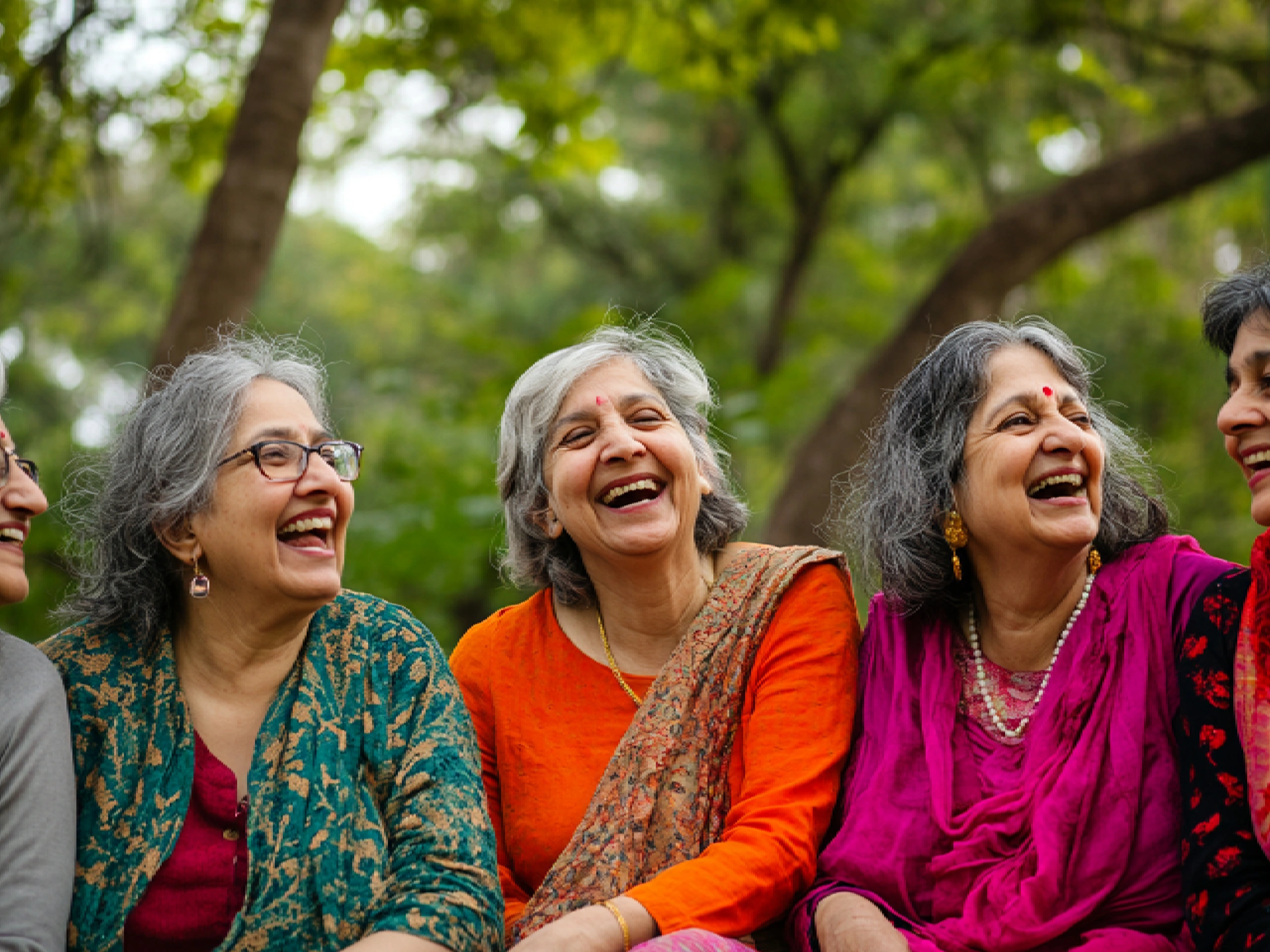 A group of happy seniors laughing together during a social activity at a senior citizen day care center.