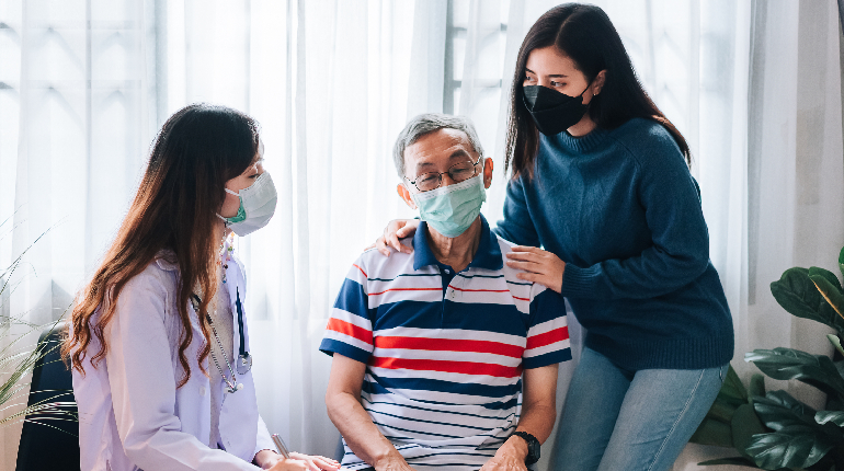 A geriatric doctor consulting with a senior resident and nurse during a daily round, emphasizing Specialized round the clock healthcare for seniors in India.