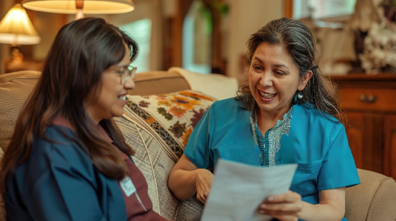 A night nurse checking on a resident at a senior care facility with round the clock healthcare in India